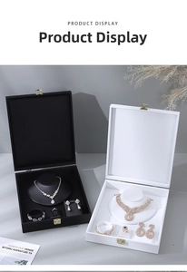 Detailed top view of luxury velvet jewelry organizer boxes with compartments and metal clasps