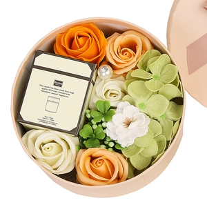 Soap flower gift box with orange roses and scented candle for Valentine or birthday