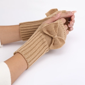 Close-up of khaki knitted fingerless gloves with bow decoration and ribbed cuffs