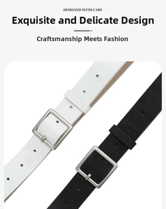 Detail of matte silver square buckles on black and white minimalist PU leather belts