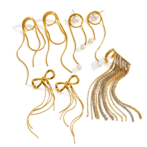 18K gold tassel earrings set with butterfly bow and pearls on white background