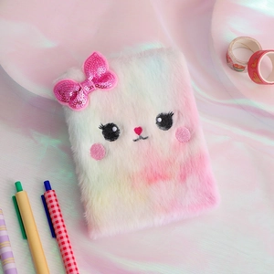 Detail of plush cat diary with gradient faux fur and pink sequined bow decoration