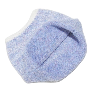 Detailed macro view of soft gradient blue mohair knit fabric with ribbed white edge