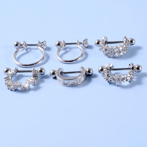 Stainless steel stud earrings with micro-set zircon in six styles on light blue background