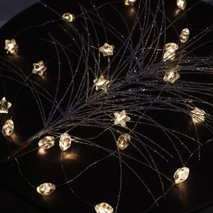 Star-shaped LED string lights with warm white glow for Christmas tree and home decoration