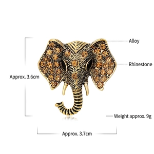 Vintage elephant head brooch in gold alloy with amber rhinestones and dimensions