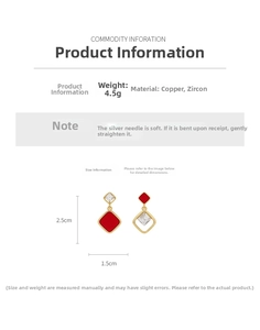 Detail view of 18k gold plated rhombus earrings with red and white cubic zirconia