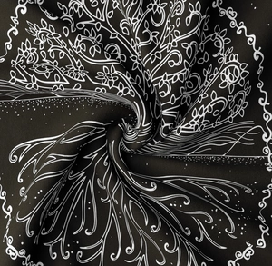 Detailed close-up of tree of life tapestry showing fine black and white fabric texture