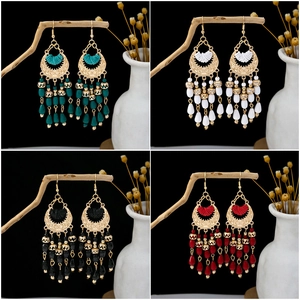 Detailed close-up of Bohemian beaded tassel earrings in four vibrant ethnic colors