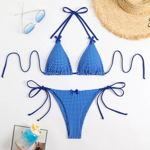 Flat lay of blue gingham bikini with halter neck, side ties, and cute bow details