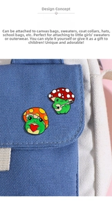 Close-up of two enamel frog pins with mushroom hats on a canvas bag accessory