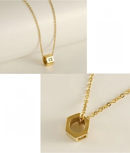 Detail of 3D hexagon pendant necklace with gold plating and sparkling zircon stone