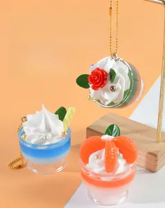 Detailed close-up of mini sundae keychain charms with colorful cream and fruit toppings