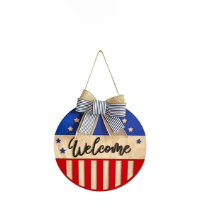 Detail of American flag themed welcome sign with burlap bow for front door decor