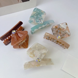 Elegant acetate claw clip set with square rhinestones in assorted earthy tones