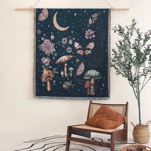 Bohemian picnic blanket with moon stars and butterfly pattern featuring elegant fringe edges