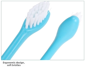 Macro view of blue pet toothbrush with soft white bristles and smooth back design