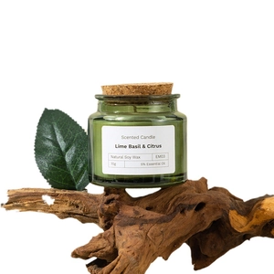 Lime Basil & Citrus natural soy wax scented candle in a green glass jar with cork lid