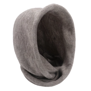 Detail of grey knitted winter scarf-hat fabric showing warm cashmere-like texture
