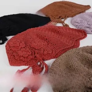 Detailed knit texture and handmade flowers on colorful crochet berets for women