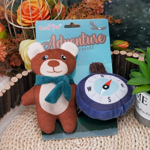 Plush dog squeaky toy set featuring a bear and compass for pets in forest adventure theme