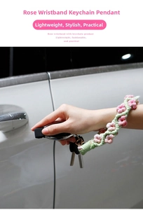 Detailed macro view of handmade crochet rose wristband keychain with metal ring