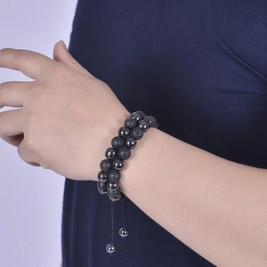 Men's double-layered bracelet with 10mm lava stones and black magnetic beads on wrist