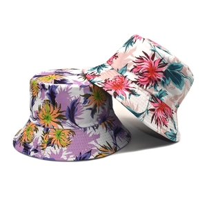 Floral reversible bucket hat with tropical patterns for sun protection in vibrant colors