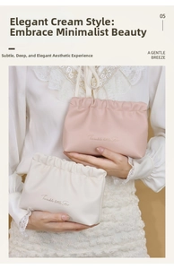 Detail of ruffled PU makeup bags in pink and cream with golden star text