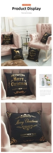 Detail of black Christmas cushion cover with gold foil reindeer and festive lettering