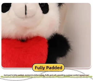 Close-up of fluffy panda plush toy holding a red heart with soft full filling detail