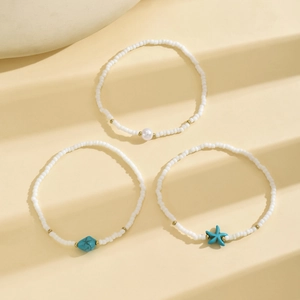 Three-piece bohemian anklet set with white seed beads and turquoise starfish charms