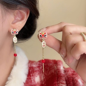 Festive Chinese style dancing lion earrings with red tassels and Lucky lettering