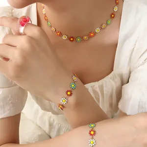 Colorful enamel daisy necklace and bracelet set with dry flower resin ring on model