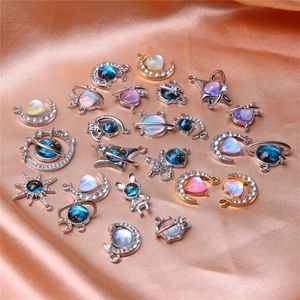 Space-themed astronaut and moon DIY pendants with crystals on elegant silk background