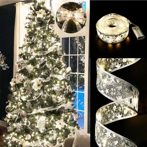 Silver LED Christmas ribbon light with warm glowing stars and snowflakes for tree decor
