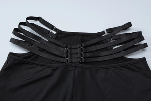 Detail of adjustable straps and metal buckles on black V-neck long sleeve set