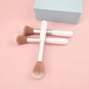 Detailed close-up of soft gradient fiber bristles on three portable white blush brushes