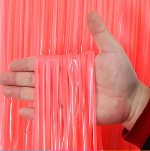 Close-up of pink macaron tinsel curtain showing glossy texture and hanging effect