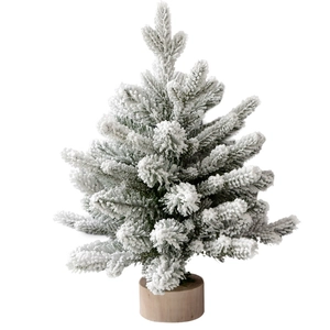 Mini tabletop snowy flocked Christmas tree with natural wood base for festive home decor