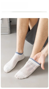 Detail of mesh cotton invisible sock with blue contrast cuff showing high elasticity and fit