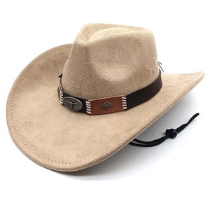 Detail of western cowboy hat featuring a metal bull head emblem on brown leather band