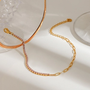 Gold stainless steel bracelet featuring pink zircon tennis chain and paperclip link design