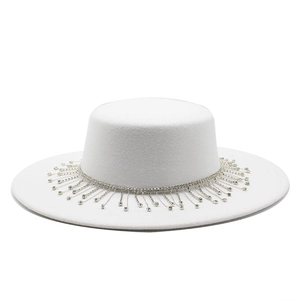 Detail of silver rhinestone fringe and crystal tassels on white felt flat brim boater hat