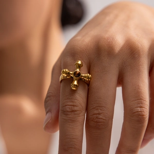18K gold plated stainless steel cross ring with a round tiger eye stone on finger