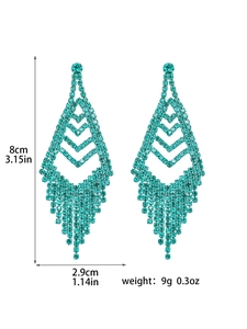 Detail view of long tassel earrings with turquoise rhinestones showing 8cm length dimensions