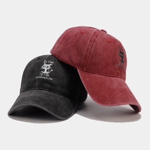 Vintage washed baseball cap with embroidered cartoon cat and humorous text for sun protection