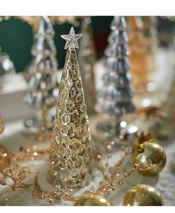 Detail of a glass Christmas tree ornament with bubble texture and metallic finish
