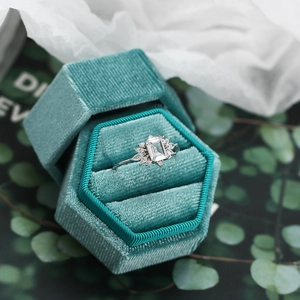 Elegant s925 silver zircon ring with emerald cut center stone in a velvet box