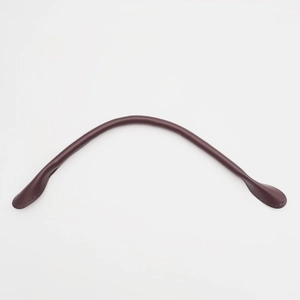 Detailed close-up of dark brown leather handbag strap with reinforced stitching details